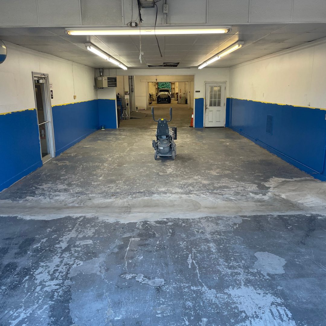 Commercial garage floor diamond-ground down to clean bare concrete and profiled, ready for coating