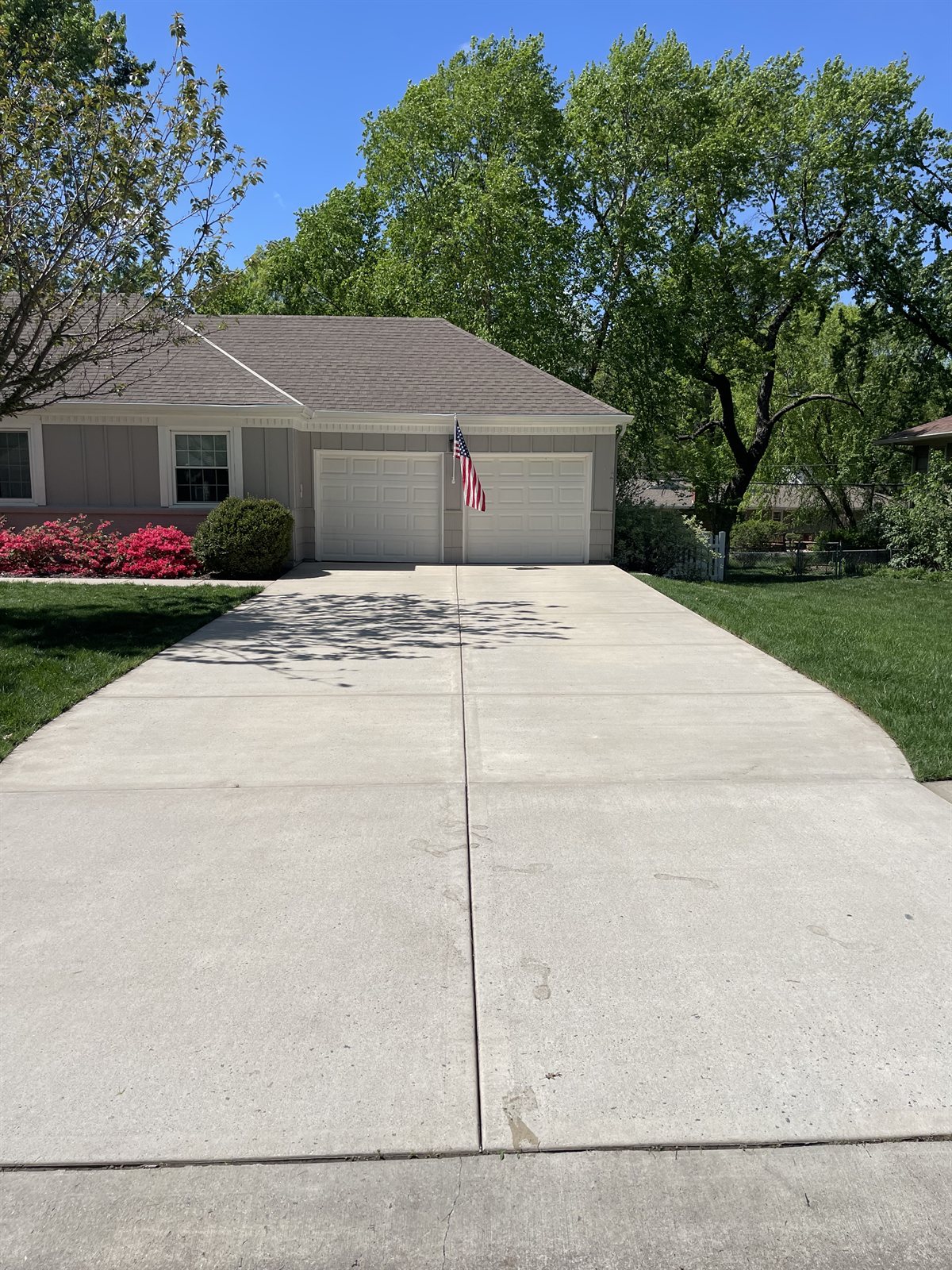 Concrete driveway in Fairway, KS after cleaning and sealing