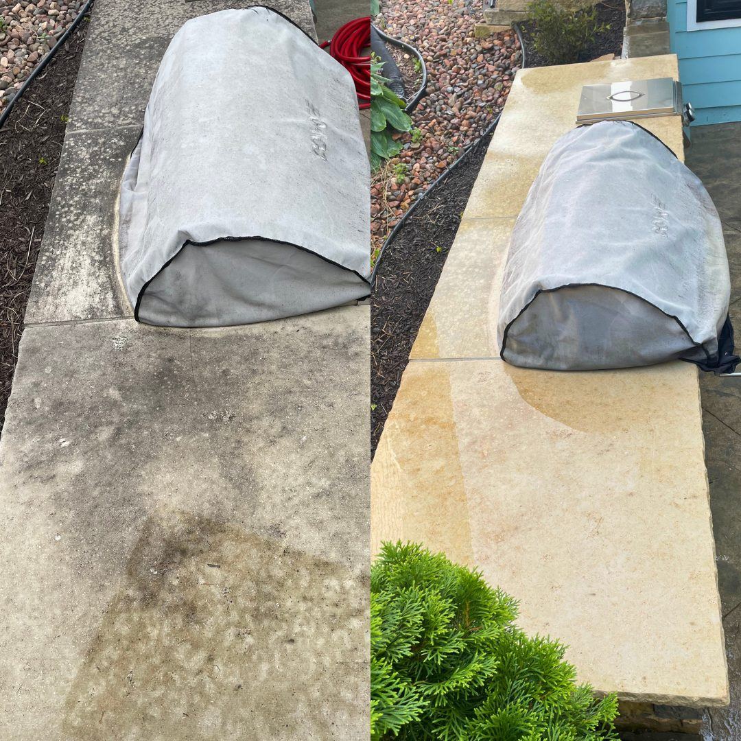 Before and after pressure washing of an outdoor grill stone countertop in Lees Summit, MO, heavy staining removed to reveal the natural stone