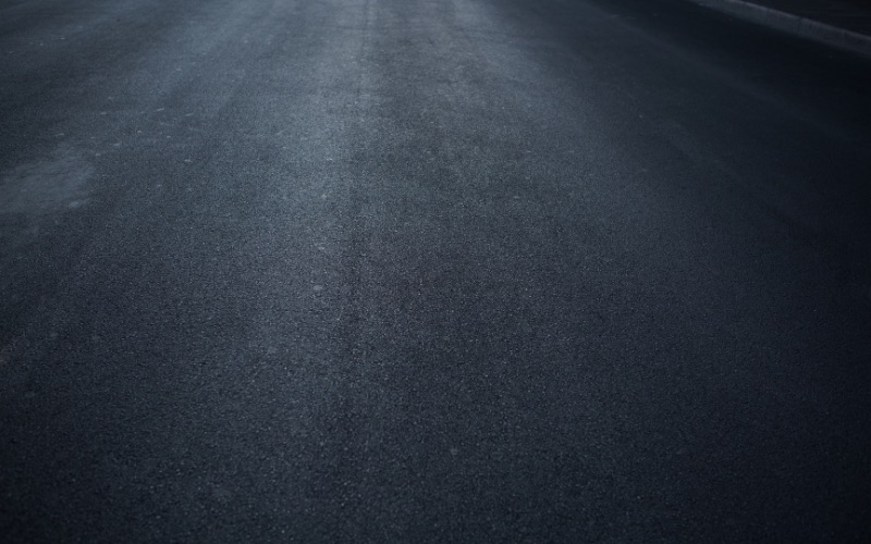 Freshly seal coated residential driveway in Kansas City with rich dark finish